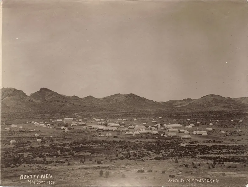 The 1905 tent town of Beatty spread across the valley floor below bare desert hills